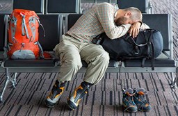 A travller sleeping at an Airport